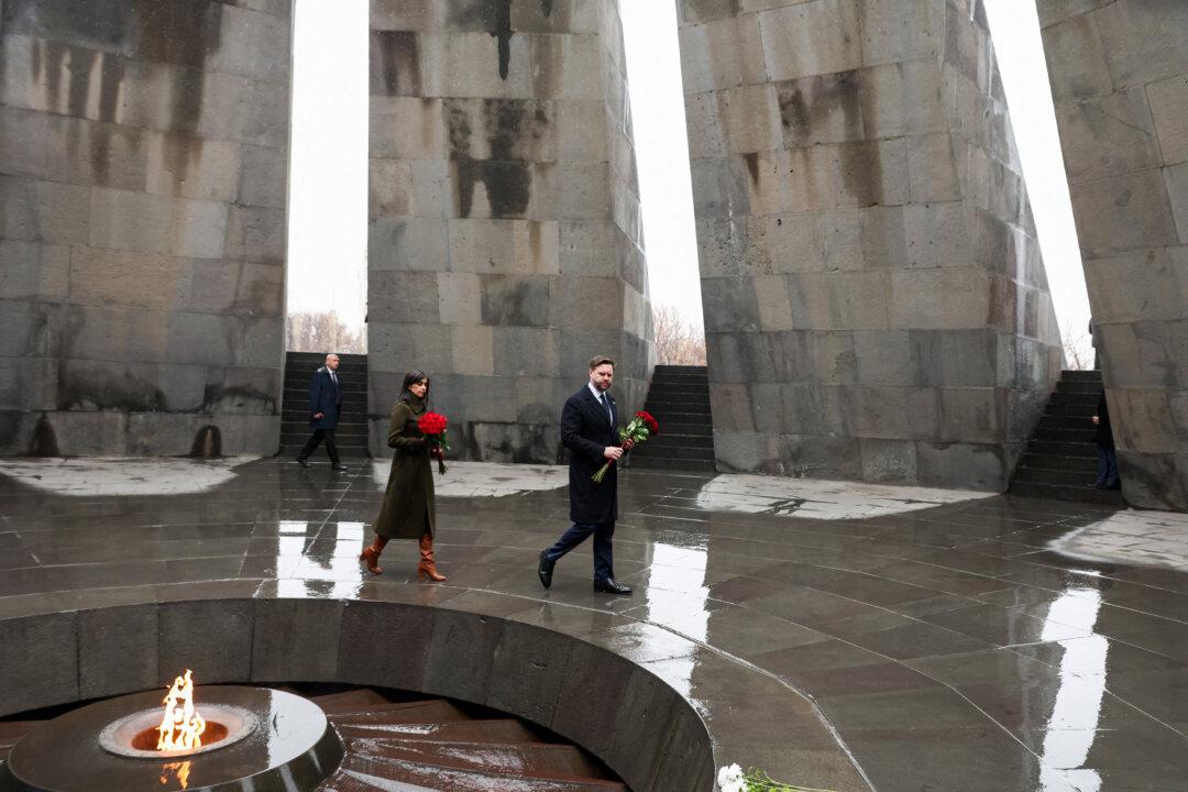 Vice President JD Vance and second lady Usha Vance pay their respects at the eternal flame during a visit to the Tsitsernakaberd Armenian Genocide Memorial, in Yerevan, Armenia, on Feb. 10, 2026. (Kevin Lamarque/POOL/AFP via Getty Images)