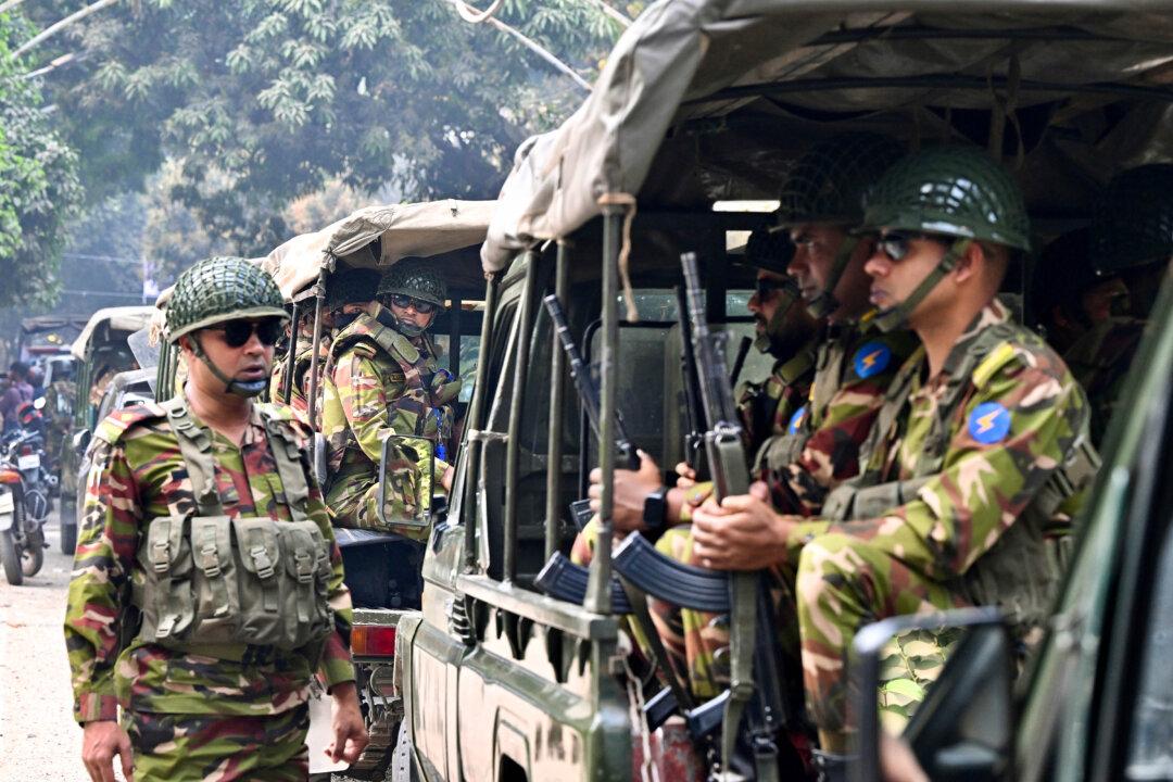 Bangladesh Army personnel patrol in Dhaka on Feb. 10, 2026, ahead of the country's general election on Feb. 12. (Munir Uz Zaman/AFP via Getty Images)