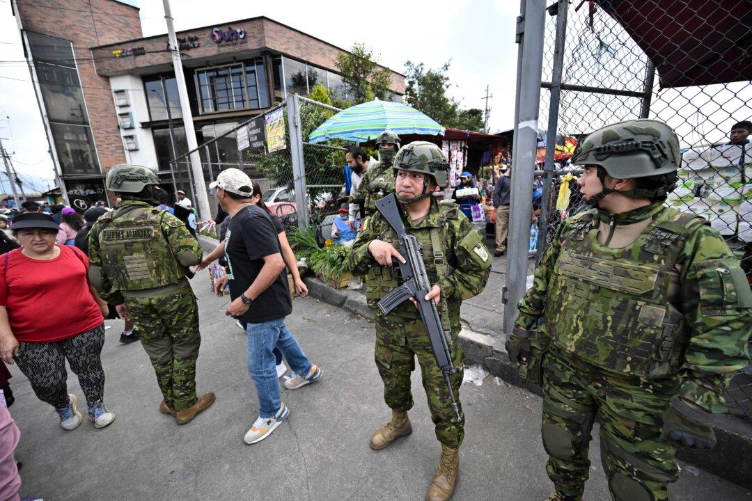 Military personnel patrol a market as they carry out weapons and drug checks as part of the fight against crime in Quito, Ecuador, on Feb. 10, 2026. (Rodrigo Buendia/AFP via Getty Images)