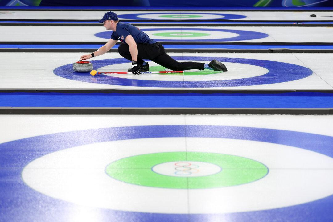 Bruce Mouat of Team Great Britain competes with Jennifer Dodds of Team Great Britain against Team Italy during the Mixed Doubles Bronze Medal Game on day four of the Milan Cortina 2026 Winter Olympic games at Cortina Curling Olympic Stadium in Cortina d'Ampezzo, Italy, on Feb. 10, 2026. (Carmen Mandato/Getty Images)