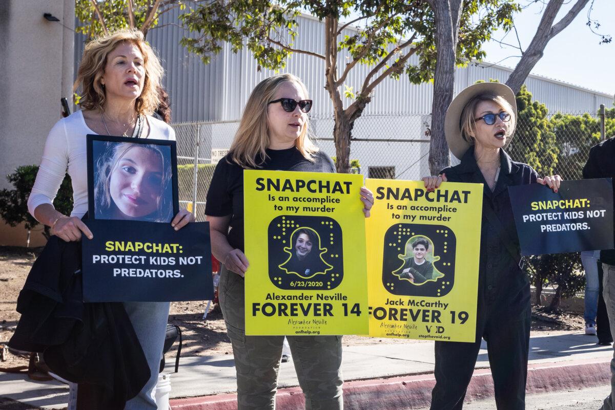 Amy Neville (C) stands near the offices of Snap Inc., in Santa Monica, Calif., on Feb. 12, 2026. (John Fredricks/The Epoch Times)
