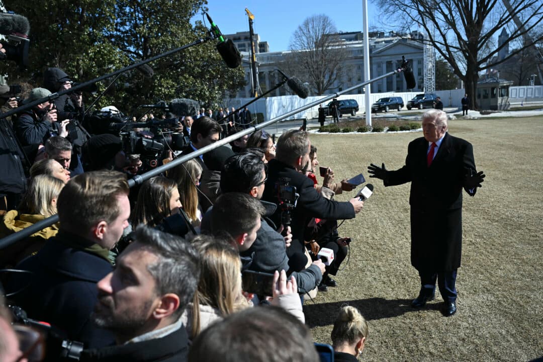 U.S. President Donald Trump speaks to the media as he walks to board Marine One prior to departure from the South Lawn of the White House in Washington on Feb. 13, 2026. (Andrew Caballero-Reynolds/AFP via Getty Images)