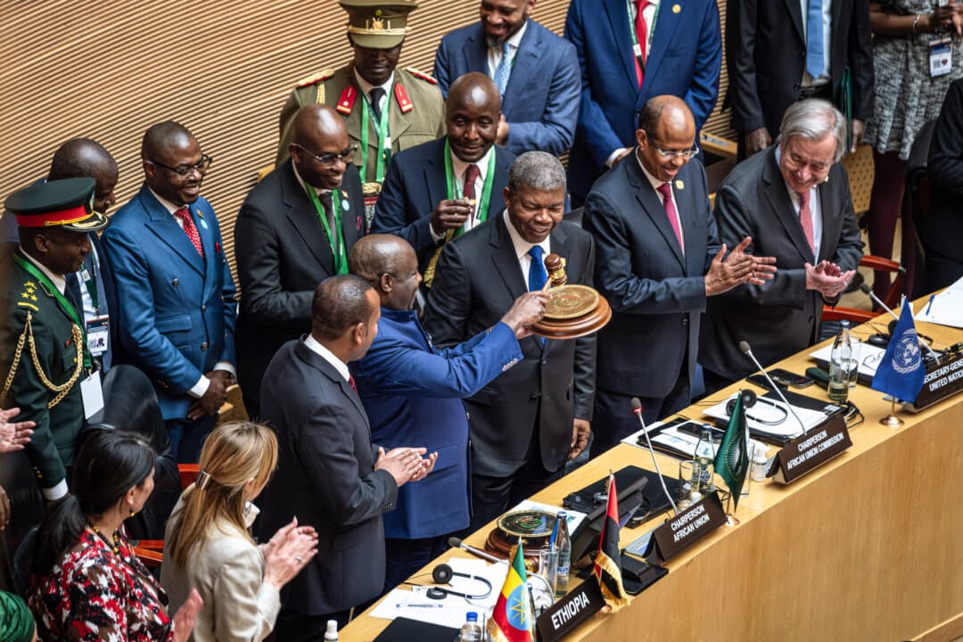 Joao Lourenço (C), president of the Republic of Angola, hands over the chairpersonship of the African Union to Evariste Ndayishimiye (center L), president of the Republic of Burundi, during the 39th Ordinary Session of the Assembly of the African Union at the AU Headquarters in Addis Ababa, Ethiopia, on Feb. 14, 2026. (Marco Simoncelli/AFP via Getty Images)