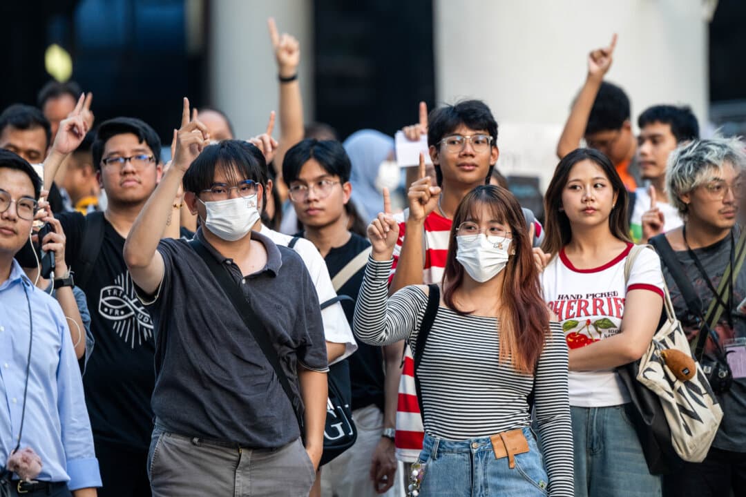 Protesters make a gesture against the process of the recent Thai election in Bangkok, Thailand, on Feb. 14, 2026. Hundreds of Thai citizens gather in downtown Bangkok to protest the election process, calling for a reelection due to allegations of fraud, irregularities, and voter information leaks, and demanding legal action against the Election Commission. (Sirachai Arunrugstichai/Getty Images)