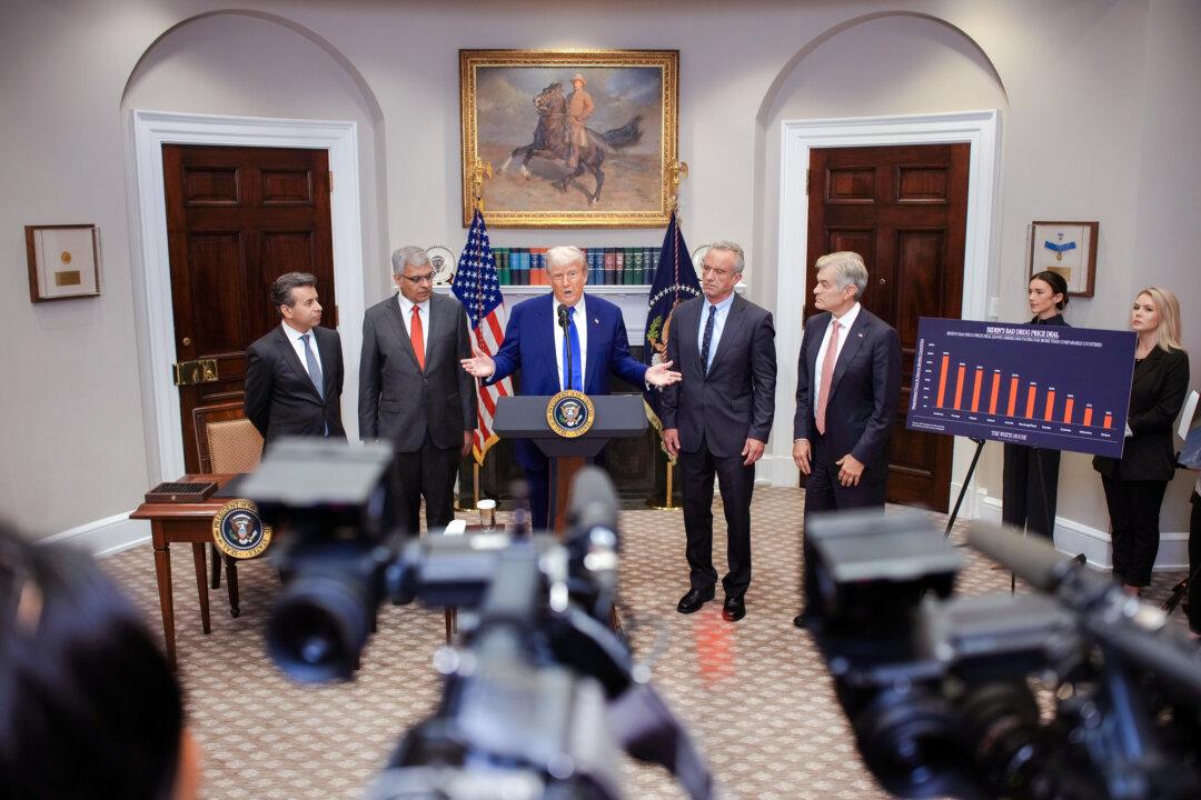 President Donald Trump (C) speaks as National Institutes of Health Director Dr. Jay Bhattacharya (2nd L) looks on during a press conference at the White House on May 12, 2025. The NIH redirected its funding priorities after Trump began his second term. (Andrew Harnik/Getty Images)