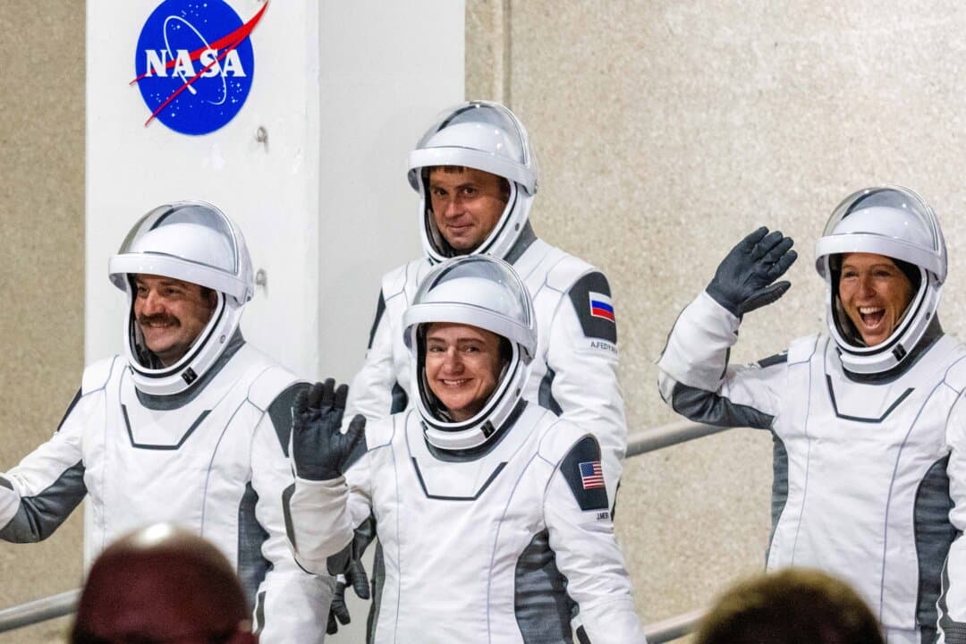 NASA astronauts Jessica Meir (C), commander, and Jack Hathaway (L), pilot, ESA (European Space Agency) astronaut Sophie Adenot (R), and Roscosmos cosmonaut Andrey Fedyaev (2nd L) walk out as they prepare to travel to the SpaceX Falcon 9 rocket with the company’s Dragon spacecraft at Space Launch Complex 40 for the Crew-12 mission at Cape Canaveral Space Force Station in Florida on Feb. 13, 2026. (Jim Watson/AFP via Getty Images)