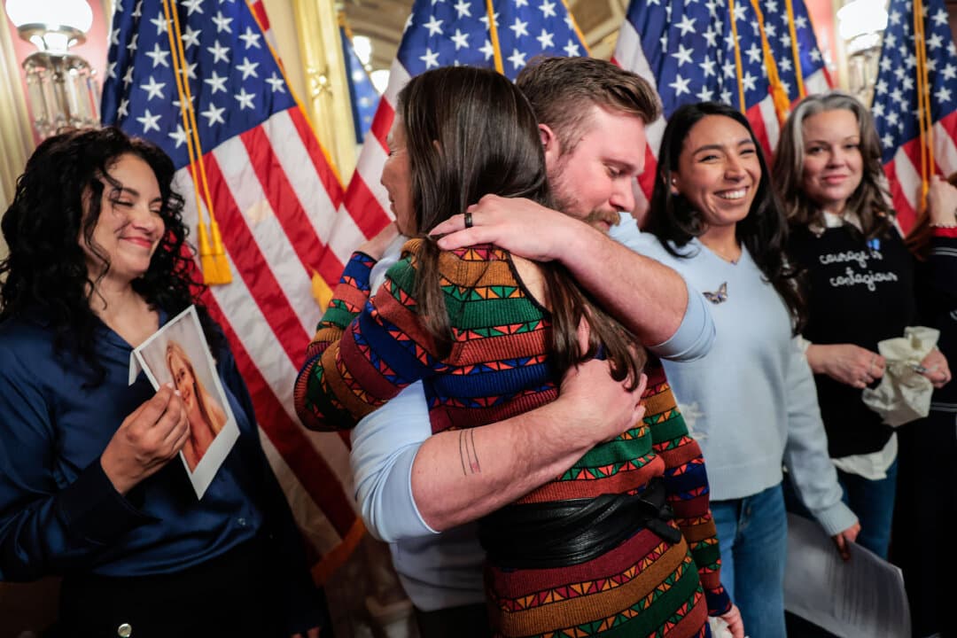 Rep. Teresa Leger Fernández (D-N.M.) hugs Sky Roberts, brother of Virginia Giuffre, a victim of Jeffrey Epstein, in Washington on Feb. 10, 2026. Senate Minority Leader Chuck Schumer (D-N.Y.) introduced “Virginia’s Law,” legislation to eliminate the statute of limitations that Schumer argues has shielded traffickers and denied survivors a chance to take their claims to court. (Heather Diehl/Getty Images)