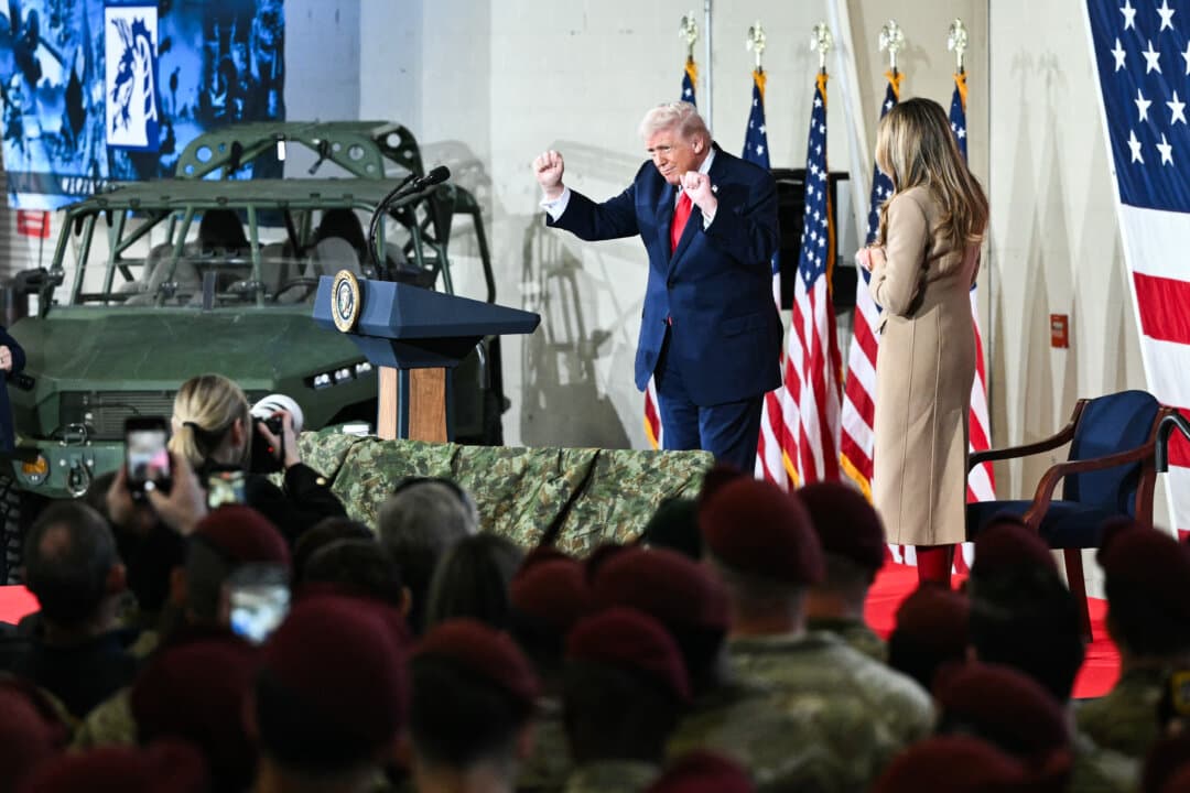 President Donald Trump dances alongside First Lady Melania Trump after delivering remarks to members of the military and their families at Fort Bragg, N.C., on Feb. 13, 2026. Trump met with the special forces soldiers who captured Venezuelan leader Nicolás Maduro. (Mandel Ngan/AFP via Getty Images)