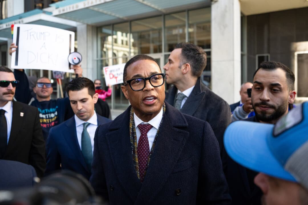 Journalist Don Lemon (C) leaves with his legal team after an arraignment hearing at the Warren E. Burger Federal Building and U.S. Courthouse in St. Paul, Minn., on Feb. 13, 2026. Lemon has pleaded not guilty to charges of conspiring to violate people’s constitutional right to religious freedom. (Stephen Maturen/Getty Images)