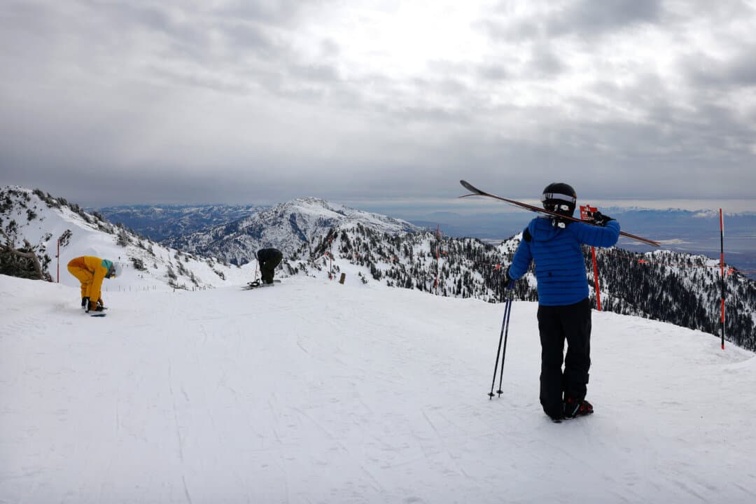 Skiers and snowboarders prepare to descend at Snowbasin Resort in the Wasatch Mountains in Huntsville, Utah, on Feb. 10, 2026. (Mario Tama/Getty Images)