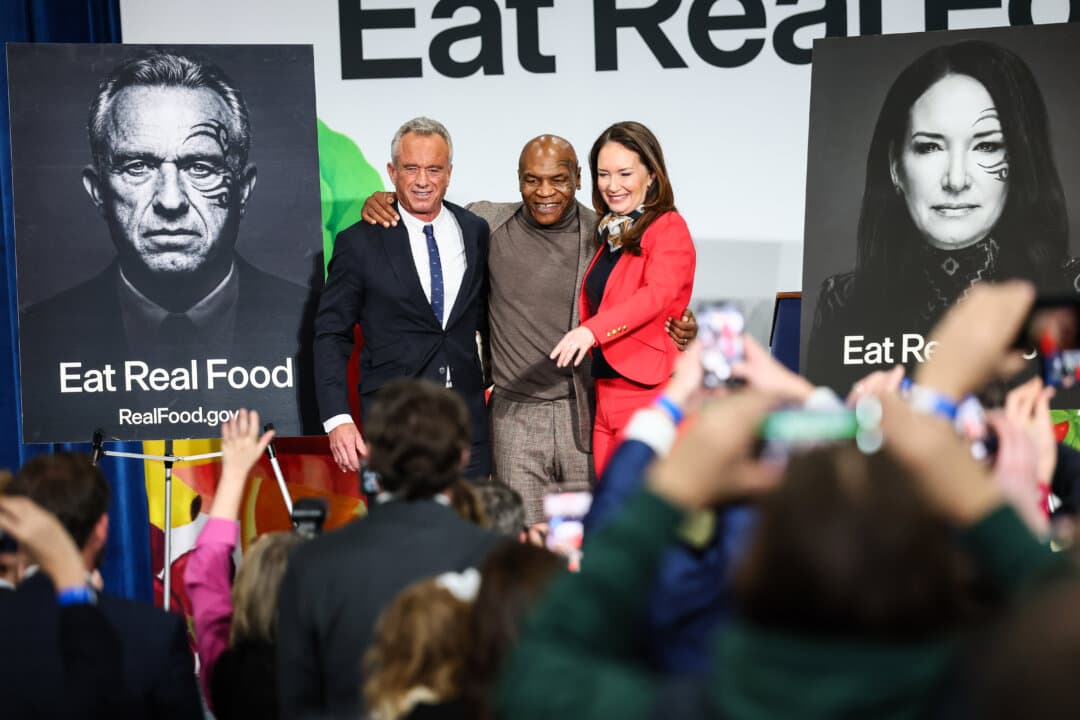 Secretary of Health and Human Services Robert F. Kennedy Jr. (L), former boxing heavyweight champion Mike Tyson (C), and Agriculture Secretary Brooke Rollins (R) take photos during an event to “Celebrate the Implementation of the Dietary Guidelines for Americans” at the Health and Human Services Headquarters in Washington on Feb. 11, 2026. (Michael M. Santiago/Getty Images)