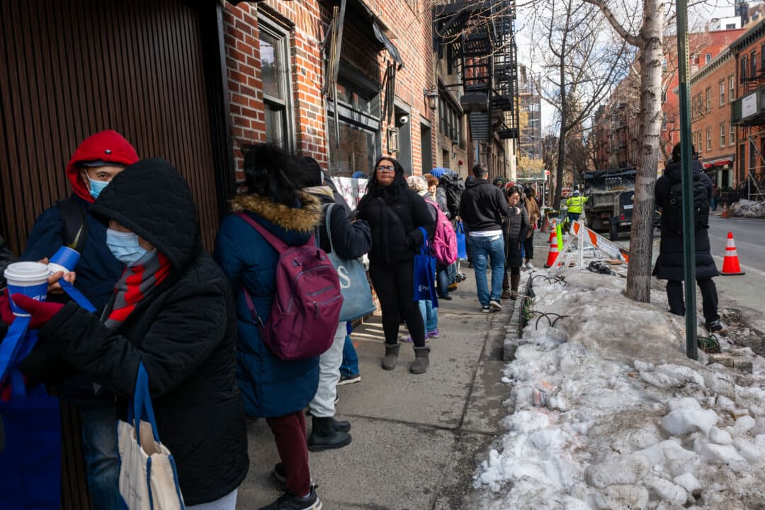 People wait in line outside of the prediction market company Polymarkets’ first free grocery store in New York City on Feb. 12, 2026. According to the company, the physical store is opening from Feb. 12 to 16, 2026, and will be fully stocked and ready for shoppers, with “no purchase required.” Polymarket allows users who download its app to bet on just about anything, including economic data, elections, sports, entertainment, and more. (Spencer Platt/Getty Images)