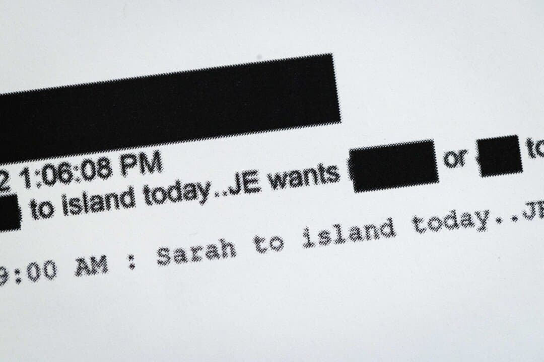 A page printed from the Epstein files released by the Department of Justice (DOJ) is shown in Chicago on Feb. 13, 2026. The DOJ has published nearly 3.5 million documents, many heavily redacted, and more than 2,000 videos and 180,000 images to comply with the Epstein Files Transparency Act. (Scott Olson/Getty Images)