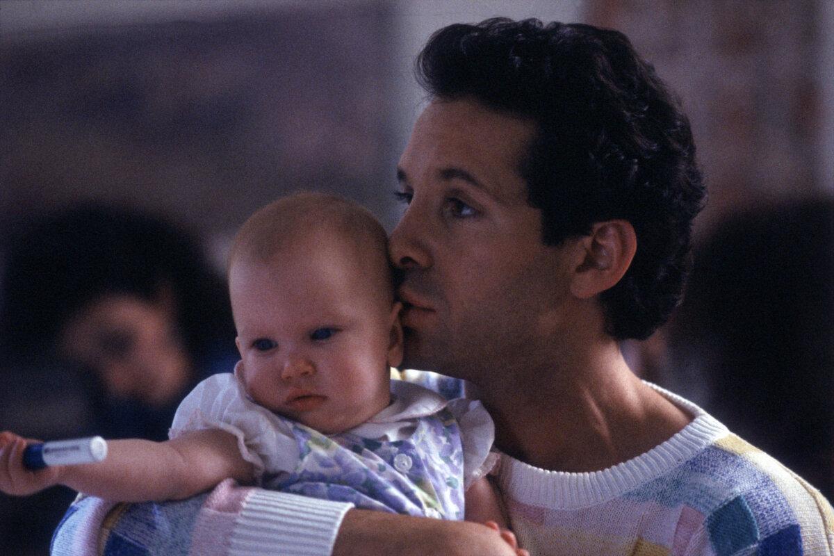 Mary (Lisa Blair) with Michael Kellam (Steve Guttenberg), in “Three Men and a Baby.” (Touchstone Pictures/MovieStillsDB)