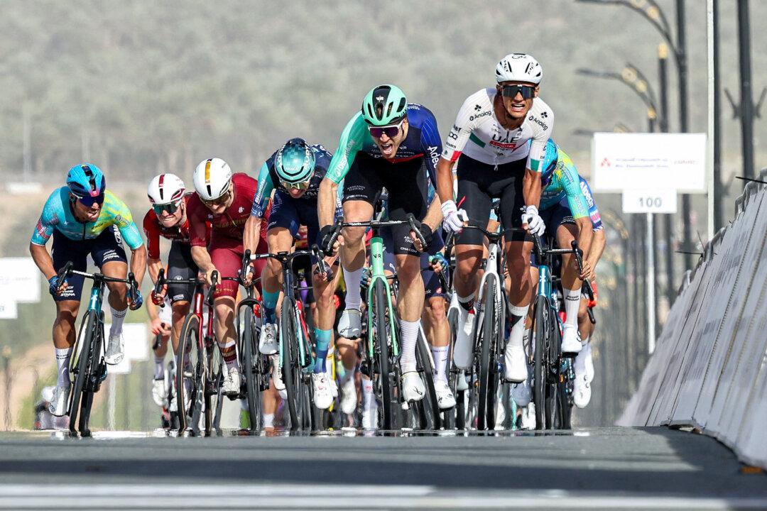 UAE Team Emirates' Mexican rider Isaac Del Toro Romero leads the pack while approaching the finish line during the first stage of the UAE Tour cycling event from Madinat Zayed Majlis to Liwa Palace in Abu Dhabi, UAE, on Feb. 16, 2026. (Fadel Senna/AFP via Getty Images)