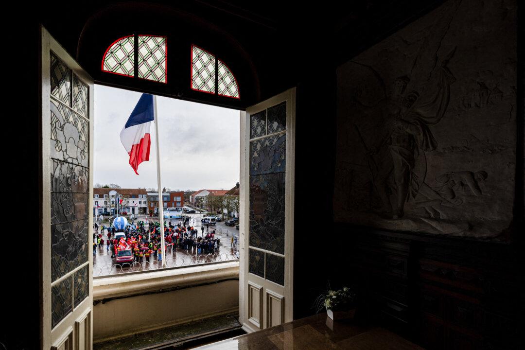 Protesters rally on the eve of the formal submission of takeover offers for glassmaking giant Arc in Arques, France, on Feb. 16, 2026. Demonstrators included political figures and about 500 employees of the glassmaker, which was placed in receivership in early January. (Sameer Al-Doumy/AFP via Getty Images)