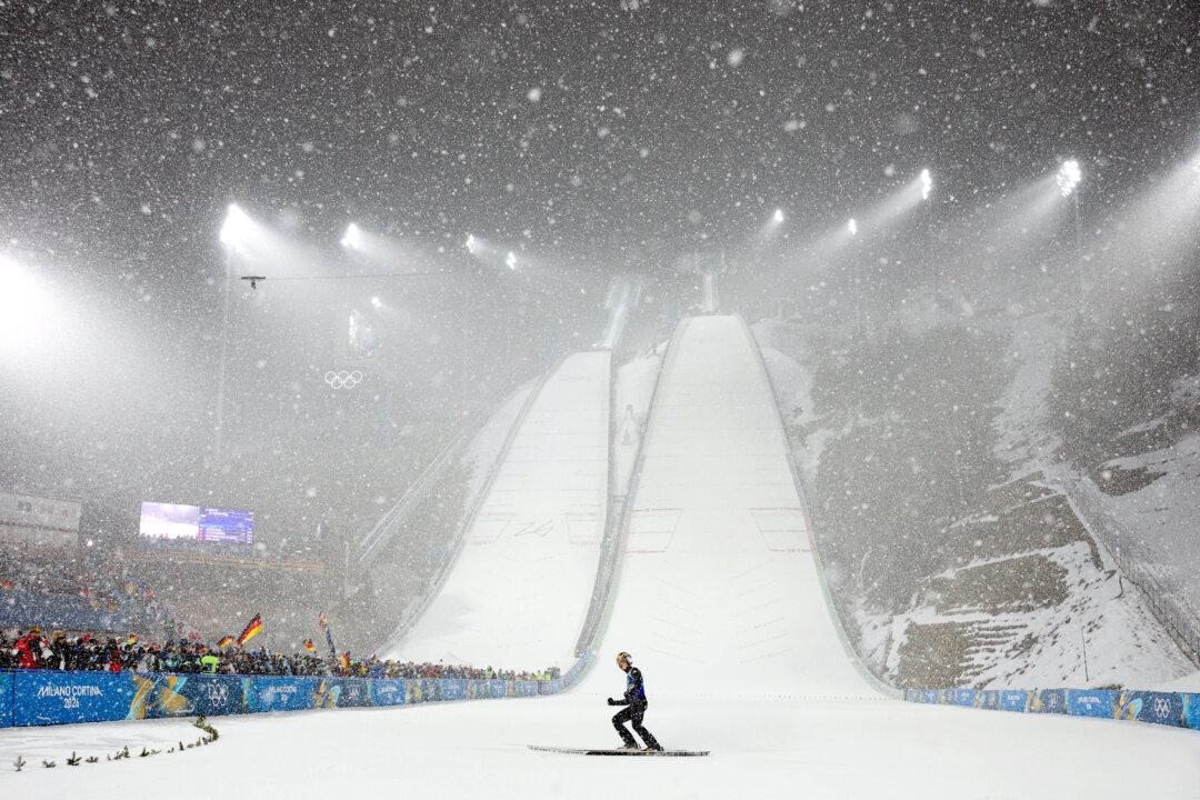 Philipp Raimund of Germany lands during the men's Super Team Final Round on Day 10 of the Milano Cortina 2026 Winter Olympic games at Predazzo Ski Jumping Stadium in Val di Fiemme, Italy, on Feb. 16, 2026. (Maddie Meyer/Getty Images)