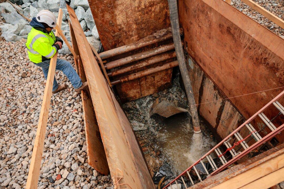 Repair work continues on the Potomac Interceptor, a six-foot-wide sewage pipe that collapsed on Jan. 19 in Cabin John, Md., on Feb. 16, 2026. More than 300 million gallons of raw sewage poured into the Potomac River after the underground pipeline collapsed on Jan. 19. (Chip Somodevilla/Getty Images)