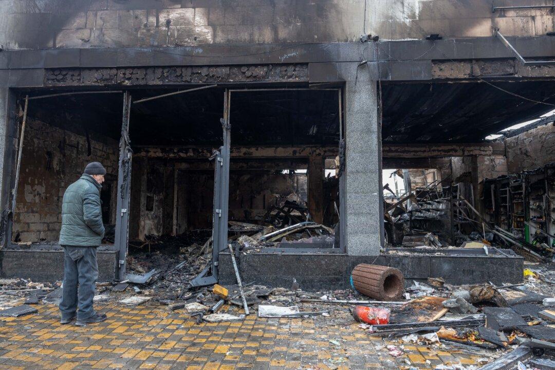 A resident stands next to a damaged grocery store at the site of a Russian attack in the port city of Odesa, on Feb. 17, 2026, amid the Russian invasion of Ukraine. After an overnight drone attack, Ukrainian officials reported two wounded in addition to damage to buildings. (Oleksandr Gimanov/AFP via Getty Images)