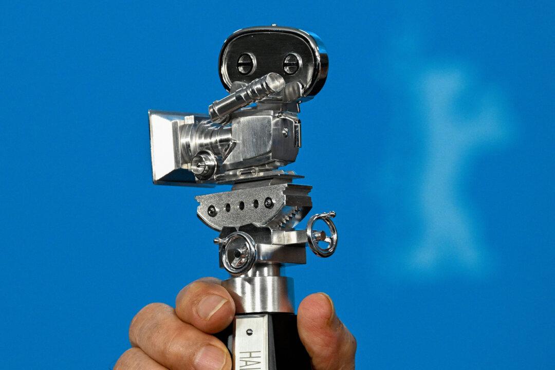 Ethiopian filmmaker Haile Gerima holds the Berlinale Camera Award in the Forum section during a photo call at the 76th Berlinale, Europe's first major film festival of the year, in Berlin, on Feb. 17, 2026. (Ralf Hirschberger/AFP via Getty Images)
