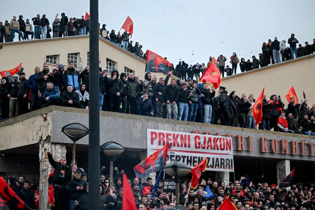 Kosovo Albanians demonstrate with KLA flags in support of former Kosovo Liberation Army leaders, including former President Hashim Thaci, on trial at The Hague's international tribunal in downtown Pristina, Kosovo, on Feb. 17, 2026. (Armend Nimani/AFP via Getty Images)