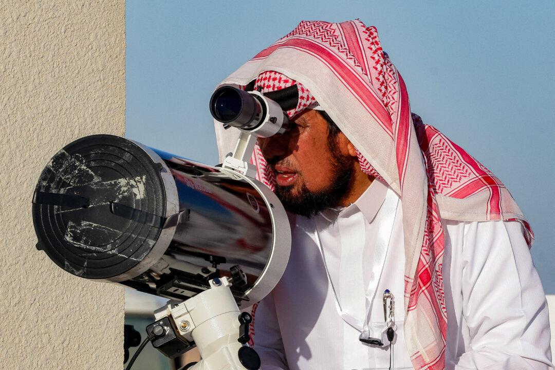 A Saudi observer uses a telescope to search for the crescent moon, to mark the start date of the Muslim holy fasting month of Ramadan, at the Majmaah University Astronomical Observatory near Riyadh, Saudi Arabia, on Feb. 17, 2026. (Fayez Nureldine/AFP via Getty Images)