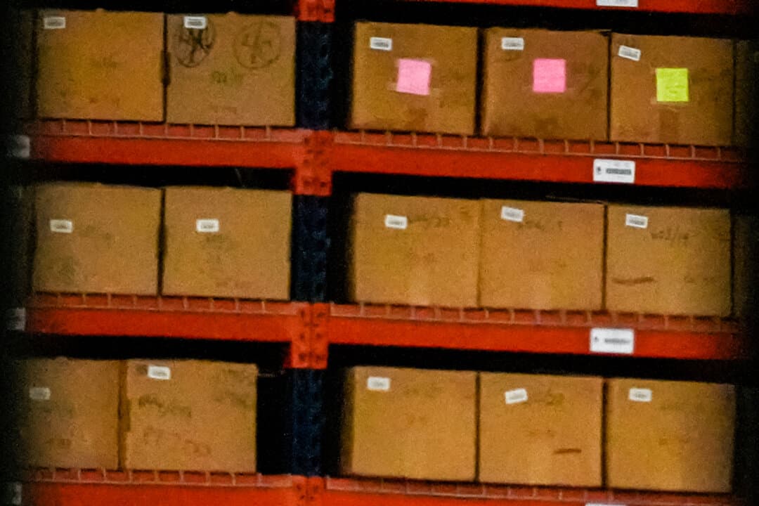 (Left) Equipment is loaded into a truck inside the Fulton County Election Hub as the FBI takes Fulton County’s 2020 election ballots in Union City, Ga., on Jan. 28, 2026. (Right) An FBI employee stands inside the Fulton County Election Hub as the FBI takes Fulton County’s 2020 election ballots in Union City, Ga., on Jan. 28, 2026. (Mike Stewart/AP Photo)