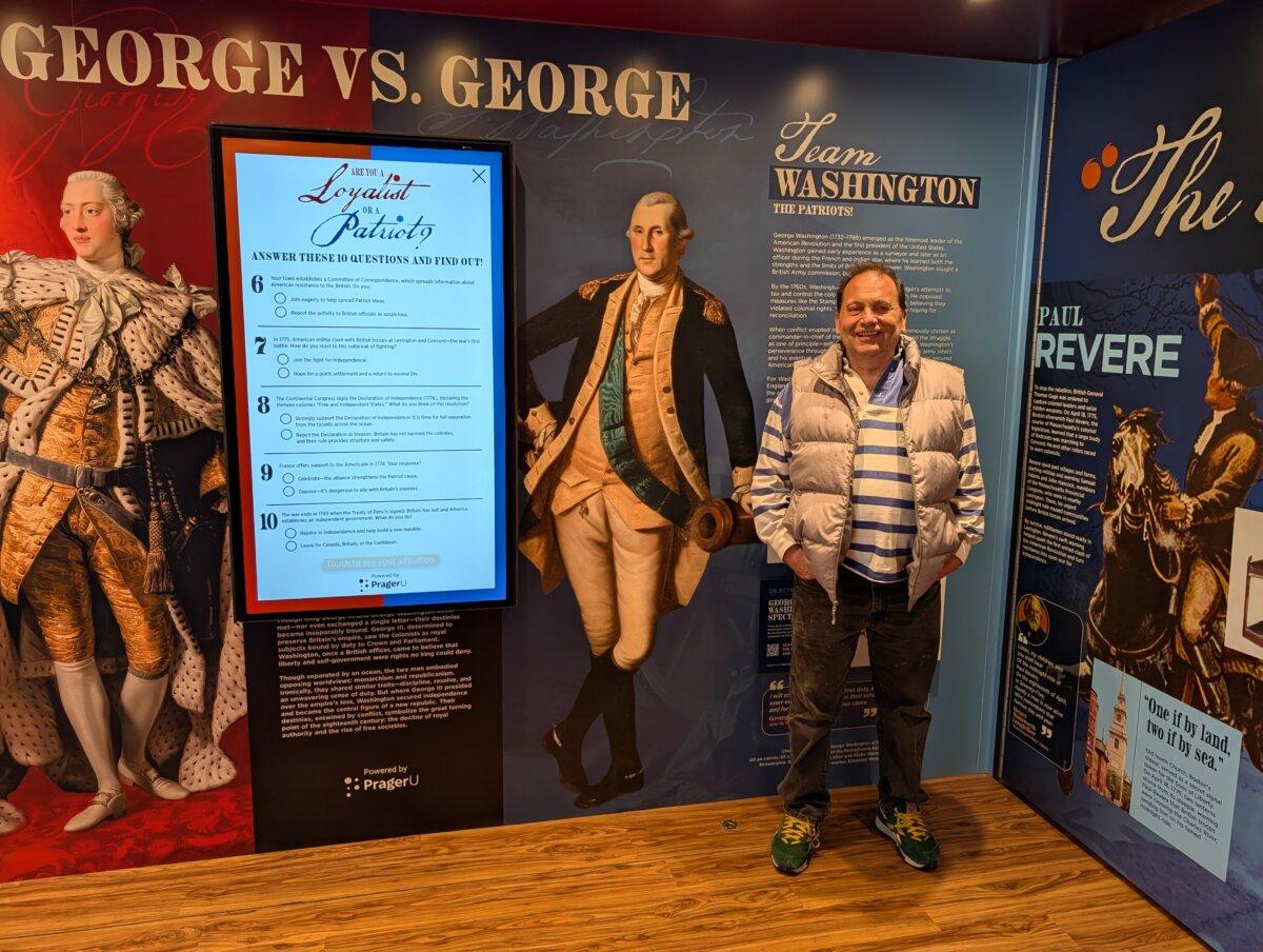 Scott Rose stops at the George vs. George wall. (Jacob Burg/The Epoch Times)