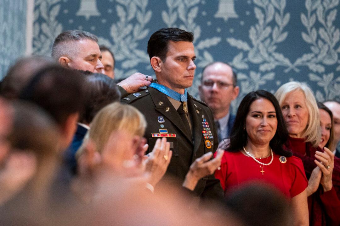 U.S. Army Chief Warrant Officer 5 Eric Slover receives a Medal of Honor during President Donald Trump's State of the Union address in the House Chamber on Capitol Hill in Washington on Feb. 24, 2026. (Madalina Kilroy/The Epoch Times)