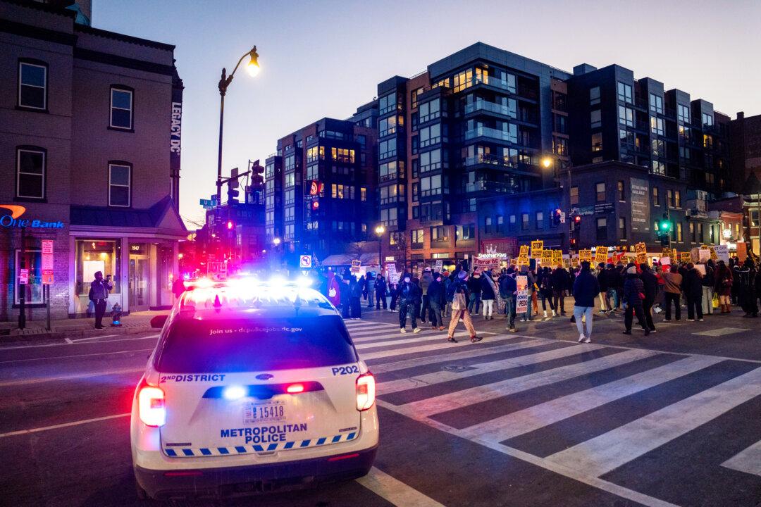 People join a march to protest against Immigration and Customs Enforcement operations in Washington on Jan. 20, 2026. (Madalina Kilroy/The Epoch Times)