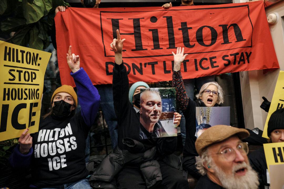 Immigration rights activists stage a sit-in at the Hilton Garden Inn in New York City on Jan. 27, 2026. Various human rights organizations and immigration rights activists took over the lobby of the hotel where ICE agents were reportedly staying. (Michael M. Santiago/Getty Images)