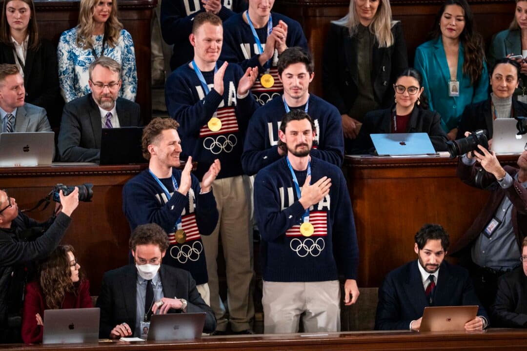 Members of the U.S. Men's Olympic hockey team attend President Trump's State of the Union address. (Madalina Kilroy/The Epoch Times)