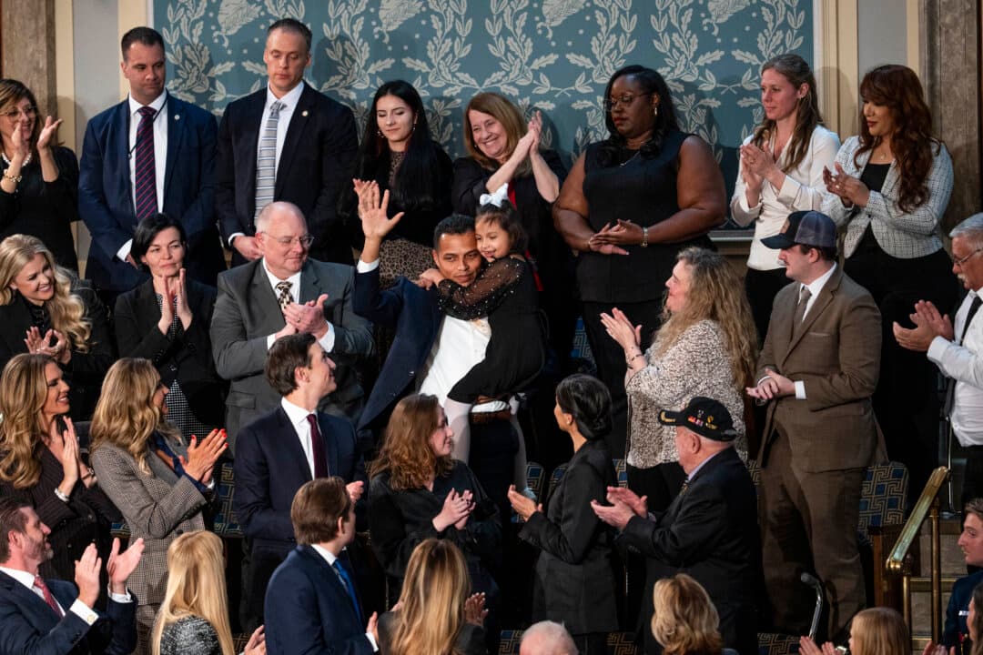 Marcus Coleman and his daughter Dalilah Coleman, who at age 5 was severely injured by an 18-wheeler driven by an illegal immigrant who had received a commercial driver’s license. (Madalina Kilroy/The Epoch Times)