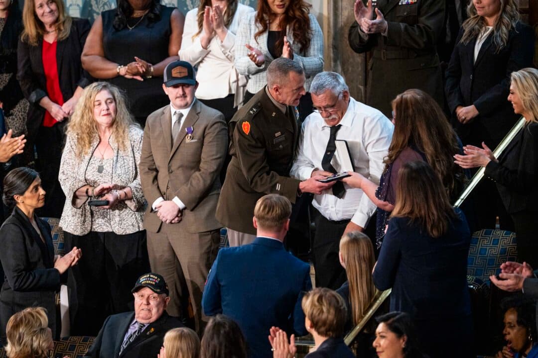 Evalea and Gary Beckstrom, parents of Sarah Beckstrom, the West Virginia National Guard member who was killed in an ambush in Washington, receive the Purple Heart. (Madalina Kilroy/The Epoch Times)