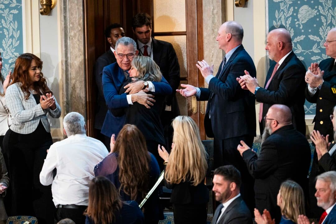 Former Venezuelan presidential candidate and recently released political prisoner Enrique Marquez hugs his niece. (Madalina Kilroy/The Epoch Times)