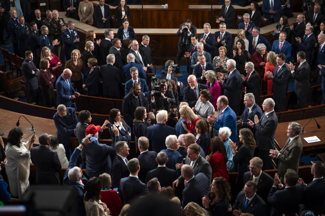 President Trump arrives in the House Chamber. (Madalina Kilroy/The Epoch Times)