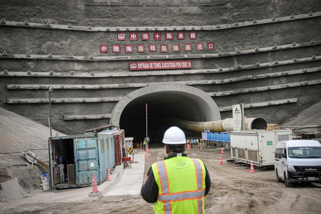 A worker stands near the entrance of a tunnel at the site where Chinese company COSCO is building a port in Chancay, some 48 miles north of Lima, Peru, on Aug. 22, 2023. (Ernesto Benavides/AFP via Getty Images)