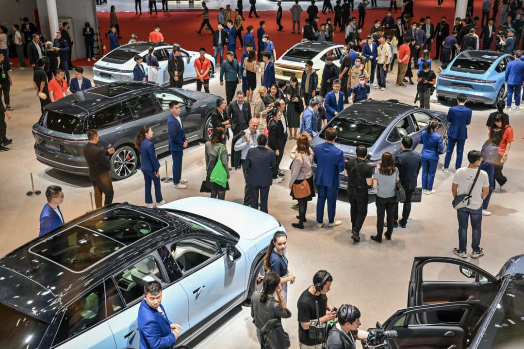 People attend the 20th Shanghai International Automobile Industry Exhibition in Shanghai on April 19, 2023. State regulators have pledged to tackle the “involution-style” competition and “disorderly price wars” in sectors such as autos. (Hector Retamal/AFP via Getty Images)