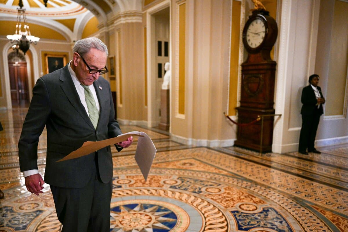 Senate Minority Leader Chuck Schumer (D-N.Y.) looks over a note before speaking to reporters following a closed-door lunch meeting with Senate Democrats at the U.S. Capitol on March 3, 2026. (Jim Watson/AFP via Getty Images)