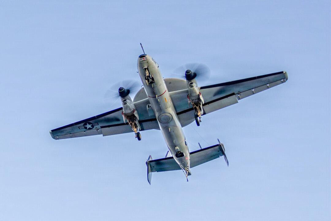 (Top) A row of some of the 15 U.S. Airforce KC-46 Pegasus tankers and one of the P-8 Poseidon tankers from the U.S. Navy are stationed at Lajes Air Base, in the Azores archipielago in the Atlantic Ocean on Feb. 23, 2026. (Bottom Left) An E-2D Hawkeye, attached to Airborne Command & Control Squadron 117, flies during Operation Epic Fury at Sea on Feb. 28, 2026. (Bottom Right) A U.S. Air Force MQ-9 Reaper drone prepares for landing at Rafael Hernandez Airport in Aguadilla, Puerto Rico, on Dec. 29, 2025. (Antonio Araujo / AFP via Getty Images, U.S. Navy via Getty Images, Miguel J. Rodriguez Carrillo / AFP via Getty Images)