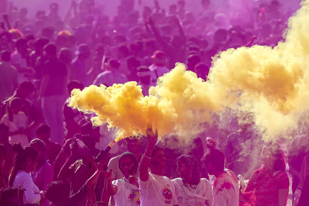 Revellers smeared with colored powder celebrate the Hindu spring festival of Holi in Pushkar, India, on March 4, 2026. (Himanshu Sharma/AFP via Getty Images)