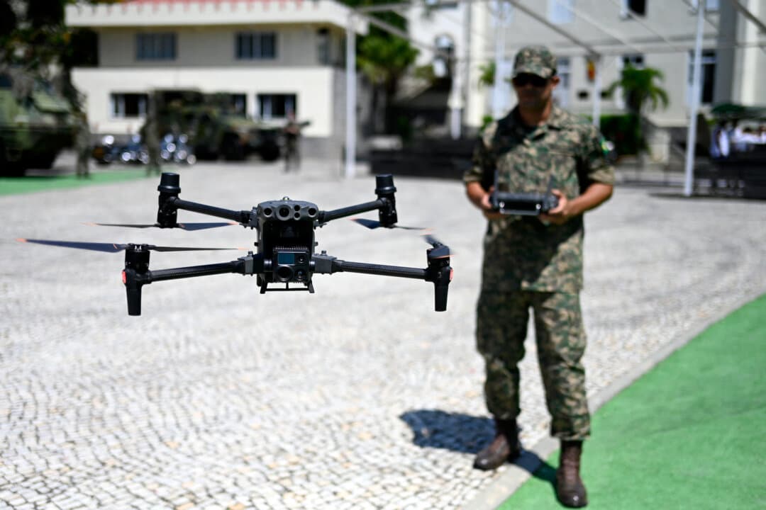 A Marine Corps officer flies a drone during a press visit to the General Command Headquarters of the Brazilian Marine Corps at Ilha das Cobras, within Guanabara Bay, in Rio de Janeiro on March 4, 2026. (Mauro Pimentel/AFP via Getty Images)