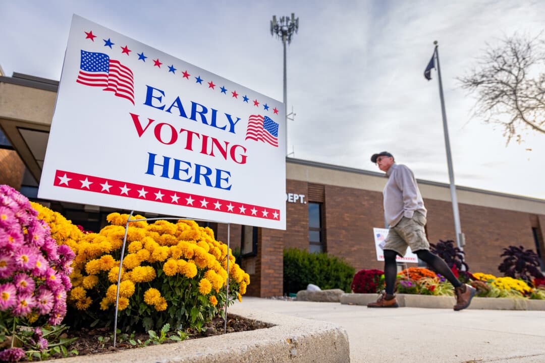 People prepare to vote early in Brown Deer, Wis., on Oct. 22, 2024. (John Fredricks/The Epoch Times)