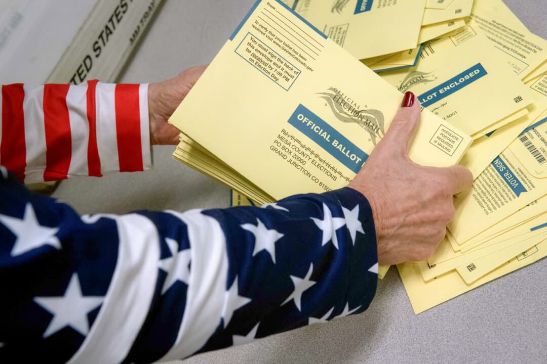 An election worker sorts ballots during the U.S. midterm election at Mesa County Central Services in Grand Junction, Colo., on Nov. 8, 2022. (Jason Connolly/AFP via Getty Images)