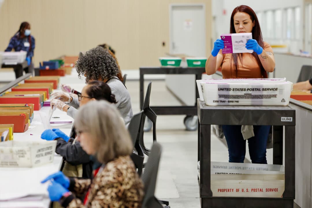 Election workers process ballots at the Los Angeles County Ballot Processing Center in the City of Industry, Calif., on Nov. 4, 2025. California has passed several election laws addressing issues such as delayed results, signature verification, and ballot return deadlines. (Mario Tama/Getty Images)