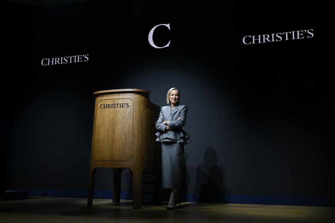 Bonnie Brennan, CEO of Christie's, poses next to The LoveFrom Christie's Rostrum at Christie's in London on March 5, 2026. Jony Ive and the LoveFrom collective have reinterpreted the rostrum to mark Christie's 260th anniversary. (Jaimi Joy/Getty Images)