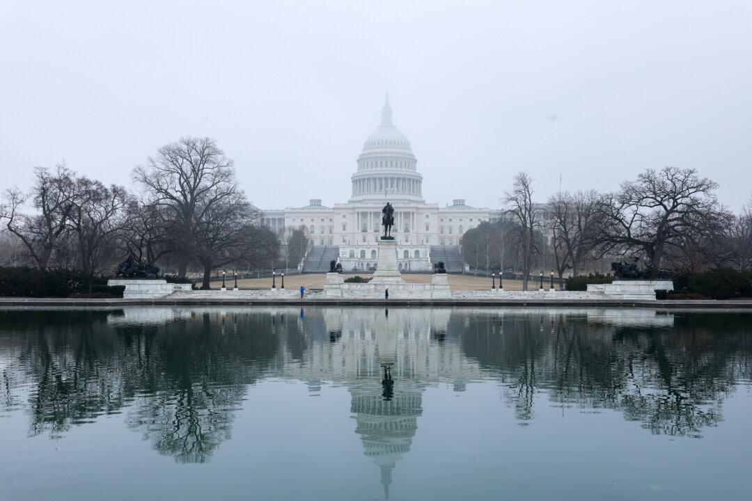 Fog hangs over the U.S. Capitol in Washington on March 5, 2026. The House of Representatives will vote on a War Powers Resolution that could prevent President Donald Trump from continuing the military campaign against Iran. (Anna Moneymaker/Getty Images)