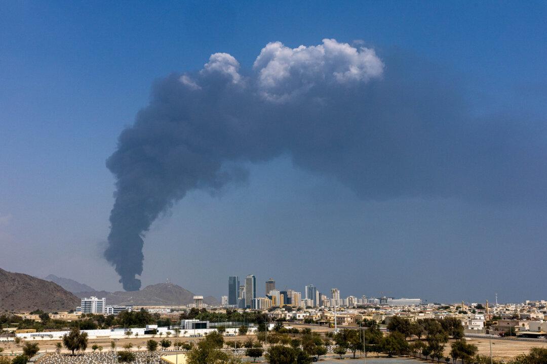 Smoke rises in the industrial zone after an explosion when air defenses intercepted a drone in Fujairah, United Arab Emirates, on March 5, 2026. Iran has fired drones and missiles toward the UAE and other Gulf states, after the joint U.S.-Israeli attack on Iran that began on Feb. 28. (Christopher Pike/Getty Images)