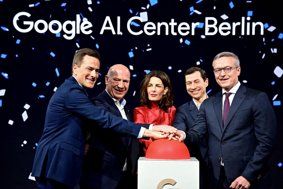 Google Managing Director Germany and Vice President Central Europe Philipp Justus, Berlin's Governing Mayor Kai Wegner, Google Vice President of Government Affairs and Public Policy Annette Kroeber-Riel, the Vice President for Research at Google DeepMind Slav Petrov, and German Digital Minister Karsten Wildberger pose for the media during the opening of a Google AI-Center in Berlin on March 5, 2026. (Tobias Schwarz/AFP via Getty Images)