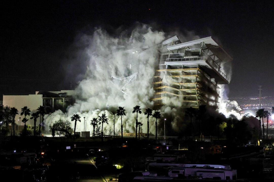 The tower of the Eastside Cannery Casino and Hotel is demolished by implosion in Las Vegas on March 5, 2026. The property closed in March 2020 due to the COVID-19 pandemic and never reopened. Owner Boyd Gaming Corp. plans to sell the land for residential development. (Ethan Miller/Getty Images)